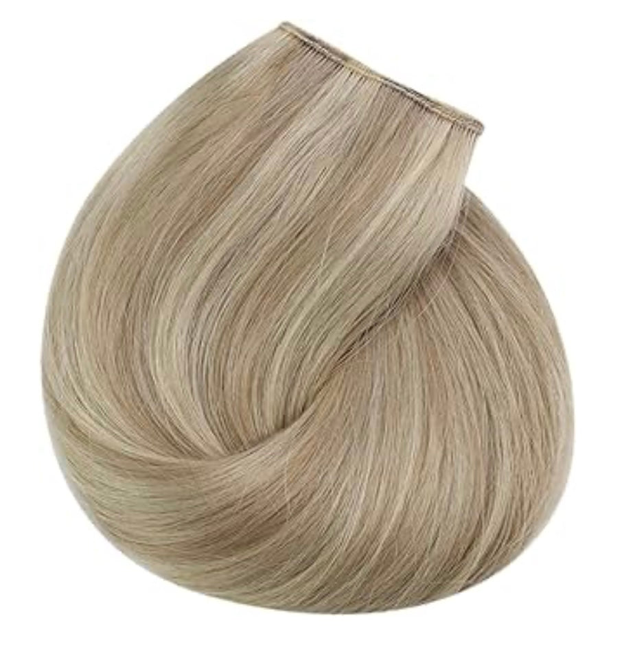 White blonde highlights blended with a neutral lowlight clip in hair extensions